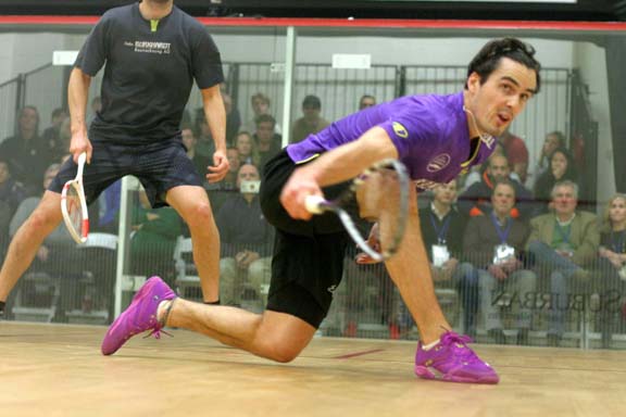 New Zealand's Paul Coll goes low to fetch a shot from semifinal opponent Nocolas Mueller. (MCO photo)