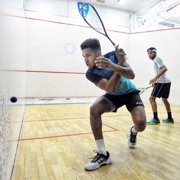 England's Richie Fallows chases down a backhand in his grueling, five-game upset of top-seeded QualifierAbdulla Mohd Al Tamimi of Qatar. (Phot by Bryan Mitchell/BAC)