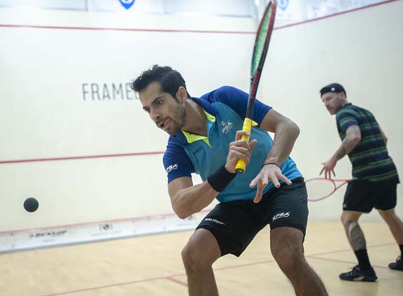 BIRMINGHAM, MICHIGAN, USA - JANUARY 29: Cesar Salazar (Mexico), front, and Peter Creed (Wales) compete in a qualifying round during the 2019 Motor City Open (MCO) squash tournament, presented by The Suburban Collection, Tuesday, January 29, 2019 at the Birmingham Athletic Club in Birmingham, Michigan. Salazar won the match. (Photo by Bryan Mitchell for BAC)